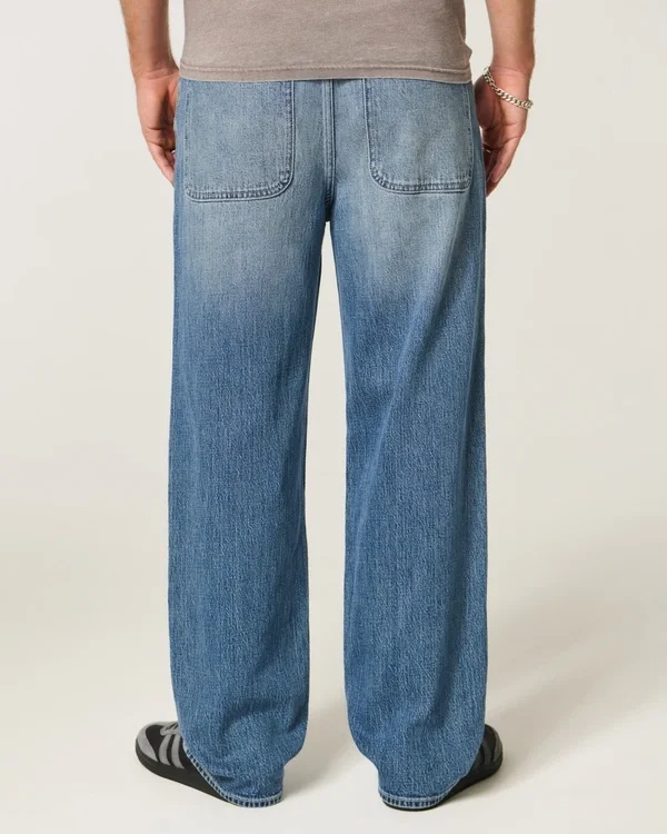 Baggy-Jeans mit Alien-Grafik in mittlerer Waschung Baggy-Jeans mit Alien-Grafik in mittlerer Waschung