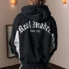 Boxy Real Madrid CF Grafik-Kapuzenjacke mit Reißverschluss Boxy Real Madrid CF Grafik-Kapuzenjacke mit Reißverschluss