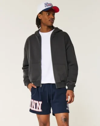 Fleece-Shorts mit UConn Huskies-Grafik, mittellang