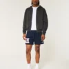 Fleece-Shorts mit UConn Huskies-Grafik, mittellang