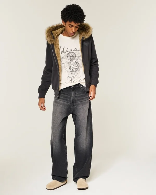 Gewaschene schwarze Baggy-Jeans mit Grafik Gewaschene schwarze Baggy-Jeans mit Grafik