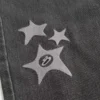 Gewaschene schwarze Baggy-Jeans mit Stern-Grafik Gewaschene schwarze Baggy-Jeans mit Stern-Grafik