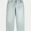 Hellblaue Skater-Baggy-Jeans mit Spielkartengrafik Hellblaue Skater-Baggy-Jeans mit Spielkartengrafik