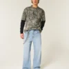 Hellblaue Super-Baggy-Jeans mit Astronauten-Grafik Hellblaue Super-Baggy-Jeans mit Astronauten-Grafik
