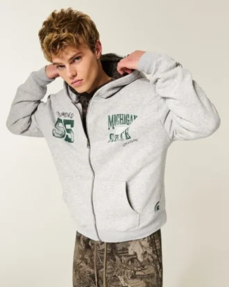 Kastenförmiger Hoodie mit Reißverschluss und Grafik der Michigan State University Spartans Kastenförmiger Hoodie mit Reißverschluss und Grafik der Michigan State University Spartans