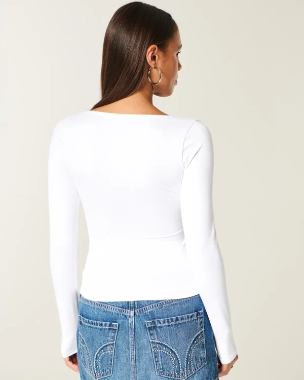 Langärmliges Baby-T-Shirt aus nahtlosem Stoff mit Rundhalsausschnitt Langärmliges Baby-T-Shirt aus nahtlosem Stoff mit Rundhalsausschnitt