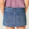 Mini-Skort aus Denim mit niedriger Leibhöhe und Nieten Mini-Skort aus Denim mit niedriger Leibhöhe und Nieten