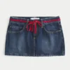 Minirock aus Denim mit niedriger Taille und Bindeband Minirock aus Denim mit niedriger Taille und Bindeband