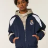 Mit Fleece gefütterte Real Madrid CF Grafik-Trainingsjacke Mit Fleece gefütterte Real Madrid CF Grafik-Trainingsjacke