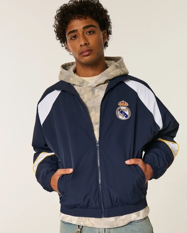 Mit Fleece gefütterte Real Madrid CF Grafik-Trainingsjacke Mit Fleece gefütterte Real Madrid CF Grafik-Trainingsjacke