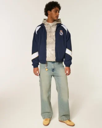 Mit Fleece gefütterte Real Madrid CF Grafik-Trainingsjacke Mit Fleece gefütterte Real Madrid CF Grafik-Trainingsjacke