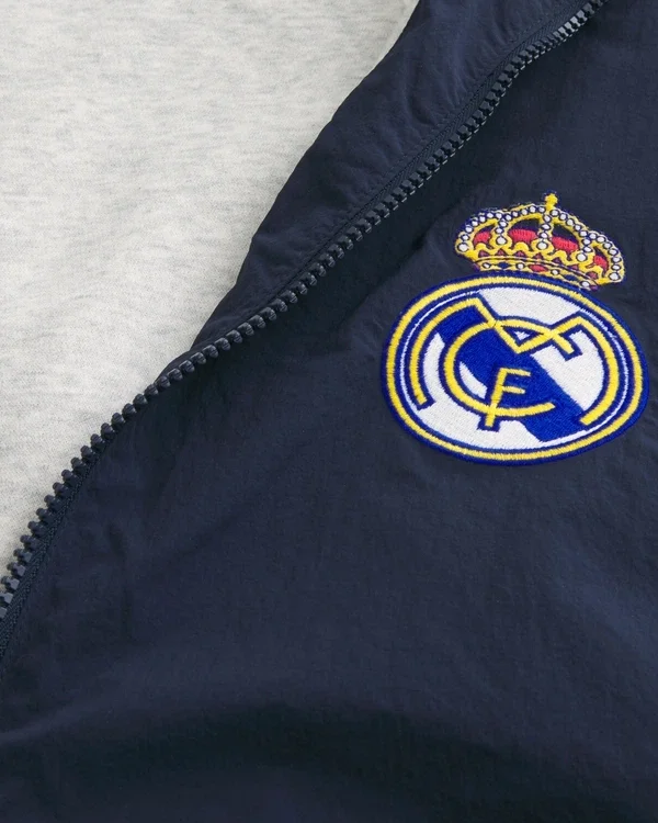 Mit Fleece gefütterte Real Madrid CF Grafik-Trainingsjacke Mit Fleece gefütterte Real Madrid CF Grafik-Trainingsjacke