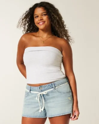 Ultra-niedrige Leibhöhe, hell gewaschene Denim-Mini-Shorts mit Spitzenband