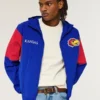 Windjacke mit Kapuze und Grafik der University of Kansas Jayhawks Windjacke mit Kapuze und Grafik der University of Kansas Jayhawks